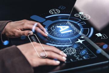 Hands typing on laptop with AI interface and digital data icons overlayed.