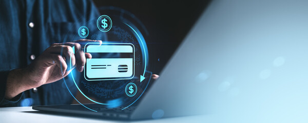 Man using credit card for online payment with digital banking icons on screen.