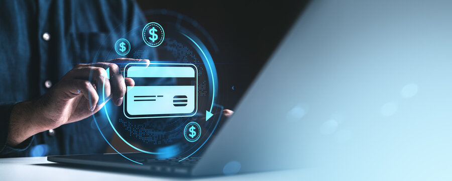 Man using credit card for online payment with digital banking icons on screen. - Powered by Adobe