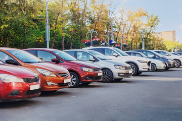 Cars parked in a row in a city parking lot