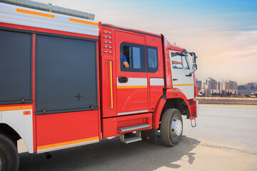 Fire Truck moves along the road towards the city