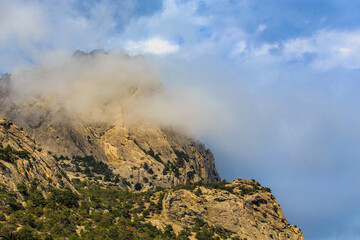 Clouds on top of a beautiful mountain