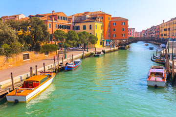 Timeless charm of Venice with picturesque canal scene, vibrant buildings and traditional boats....