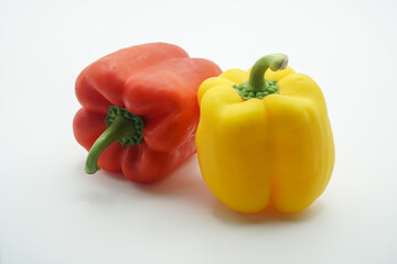 Fresh Red and Yellow Bell Peppers on White Background A Culinary Delight