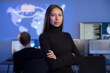 Professional Female Analyst Working in a Security Operations Center with Digital Displays