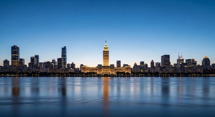 Vibrant city skyline at twilight featuring illuminated skyscrapers and a prominent landmark building with reflections on the calm river.