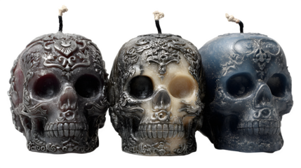 Halloween themed candle gift set in skull-shaped holders, isolated on white background