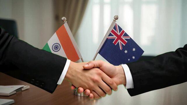 Business leaders shake hands, symbolizing a strong partnership between India and Australia, fostering global collaboration and economic growth.