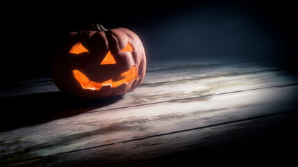 ominous. Carved Halloween pumpkin emitting an eerie orange glow, placed on weathered wooden planks for a spooky effect. event programs.