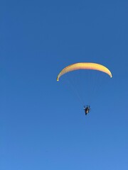 paragliding in the blue sky