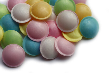 Flying saucer UFO shape sweet colorful candies on white background
