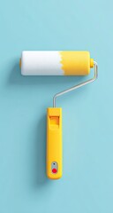 Yellow paint roller on light blue background
