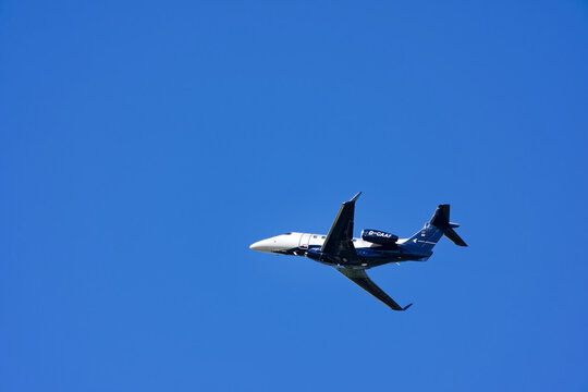 Private jet Arcus Air Embraer Phenom 300 registration registration D-CAAF taking off form Swiss Airport Z&uuml;rich Kloten on a sunny late summer day. Photo taken September 19th, 2025, Zurich, Switzerland.