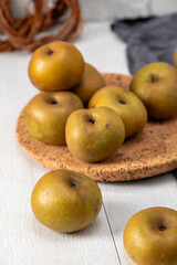Still life of rustic green apples