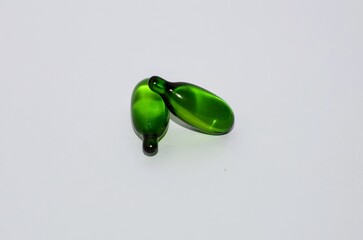 Vitamin Green Capsules on White Background – Health and Wellness Supplement Photography