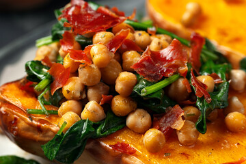 Roasted stuffed butternut squash with chickpeas and bacon. Healthy seasonal fall or autumn food.