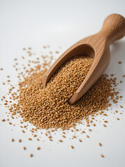 Close up of flaxseed in wooden scoop and bowl on white background