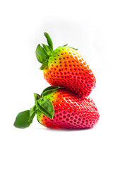 Bright red strawberries placed on a white background.