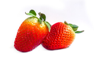 Bright red strawberries placed on a white background.