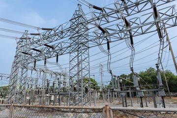 High voltage take off structure in electrical substation with steel framework, power lines, and insulators, representing electricity transmission and modern energy infrastructure.