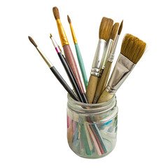 Variety of paintbrushes in a glass jar for art projects and creative painting on canvas or paper