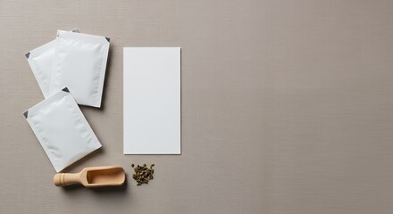 Flat lay mockup of gardening seed packets, a small wooden scoop, and loose seeds on a neutral gray background, showing a simple