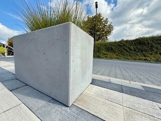 Modern concrete planter with clean lines and minimal design. Contemporary outdoor decoration for gardens, terraces, or patios.