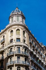 Fototapeta premium Barcelona iconic architecture is a timeless reminder of its history, with beautiful blue buildings stretching to the sky. A perfect travel destination for all