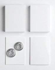 Two blank boxes and cards with embossed metallic circles atop a white background.  Clean, minimalist design showcasing mockups