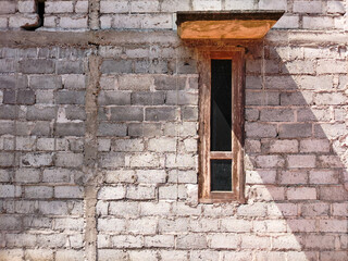 Raw brick walls with wooden windows