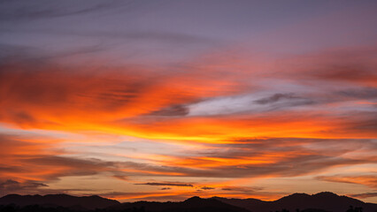 Dramatic Dusk, Evening Sky Clouds on Twilight over mountain horizon landscape Orange, purple Sunset...