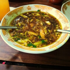 Soto Lamongan or Lamongan chicken soup with shredded chicken, traditional Javanese Indonesian food 