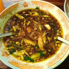 Soto Lamongan or Lamongan chicken soup with shredded chicken, traditional Javanese Indonesian food 