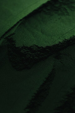 Spirulina powder close up, green superfood, organic healthy supplement