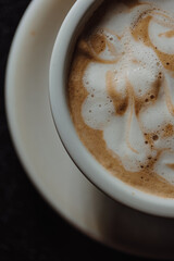 Coffee with milk close up, creamy foam, hot drink