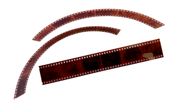 A transparent brown negative film roll with a perforated frame typical of analog cameras, with a transparent background.