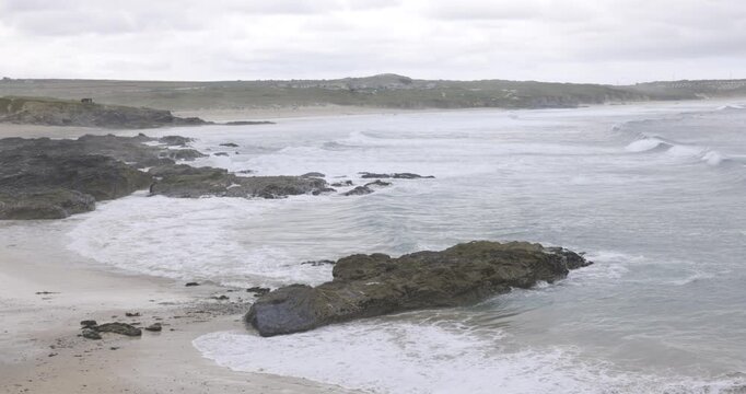 Cornwall seaside view with waves and cliffs