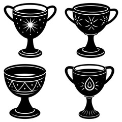 Collection of four ornate black and white goblets with different decorative patterns and unique shapes