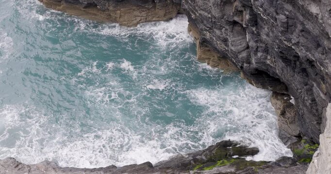 Cornwall seaside view with waves and cliffs