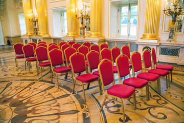 Red chairs in the hall of the Grand Palace of the Tsaritsyno Museum Reserve. The sights of Moscow are World tourism.