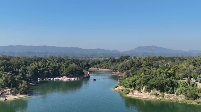 Scenic Aerial Drone Flight Towards the Iconic Rangamati Hanging Bridge (Jhulonto Bridge) over Kaptai Lake, Bangladesh.