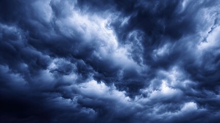 Obraz premium Dramatic storm clouds in deep blue, a sweeping skyscape with dynamic light, nature's raw power on display