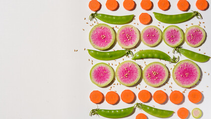 Naklejka premium Vibrant fresh vegetables and radishes on a white background