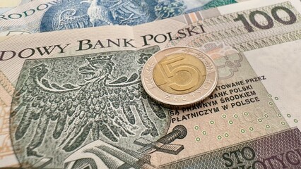 5 Polish Zloty Coin on Banknotes – Currency and Finance Concept