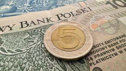 5 Polish Zloty Coin on Banknotes – Currency and Finance Concept