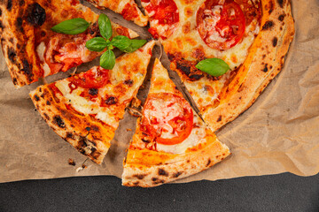 Pizza tomato margarita fast food natural product tasty snack fresh delicious gourmet food background on the table rustic top view copy space