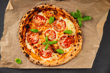 Pizza tomato margarita fast food natural product tasty snack fresh delicious gourmet food background on the table rustic top view copy space