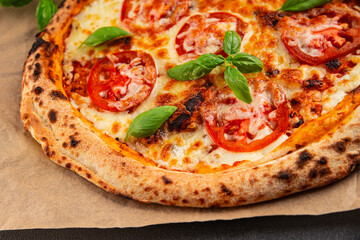 Pizza tomato margarita fast food natural product tasty snack fresh delicious gourmet food background on the table rustic top view copy space