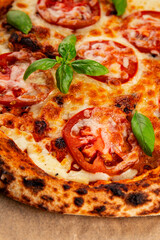 Pizza tomato margarita fast food natural product tasty snack fresh delicious gourmet food background on the table rustic top view copy space