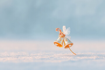 cozy winter scene through window shows pine branch adorned with frost and handwritten emmanuel greeting